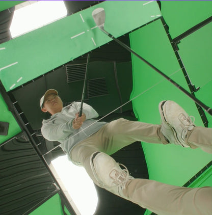 Golfer standing on the Mirror Mat, showing full-body reflection.  Allowing a golfer to clearly see their club, posture, body lines, and body and club movements at a “life-size” scale.